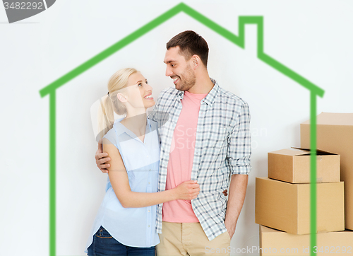 Image of couple with cardboard boxes moving to new home