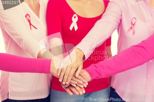 Image of close up of women with cancer awareness ribbons