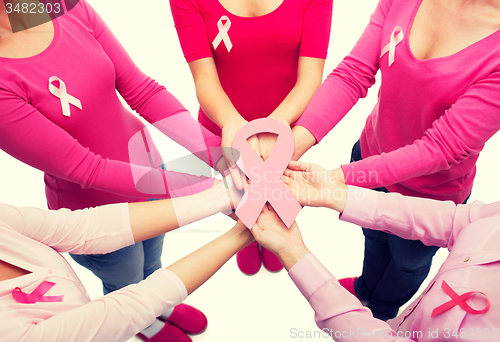 Image of close up of women with cancer awareness ribbons