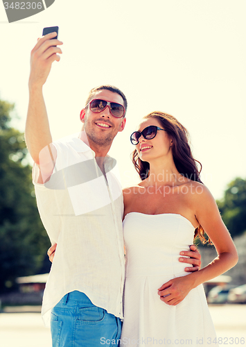Image of smiling couple in city