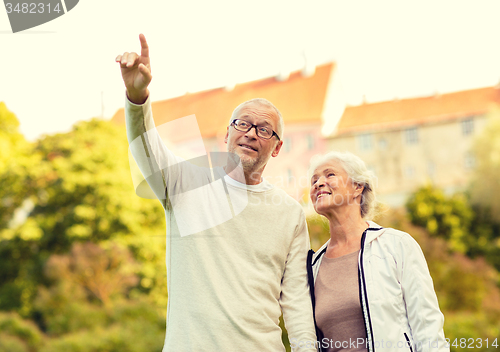 Image of senior couple in city park