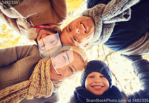 Image of happy family in autumn park