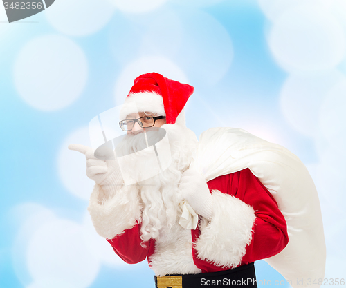 Image of man in costume of santa claus with bag