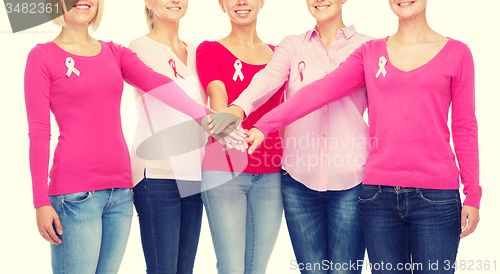 Image of close up of women with cancer awareness ribbons