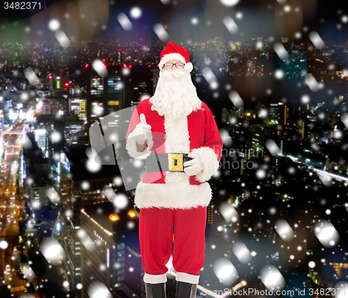 Image of man in costume of santa claus with gift box