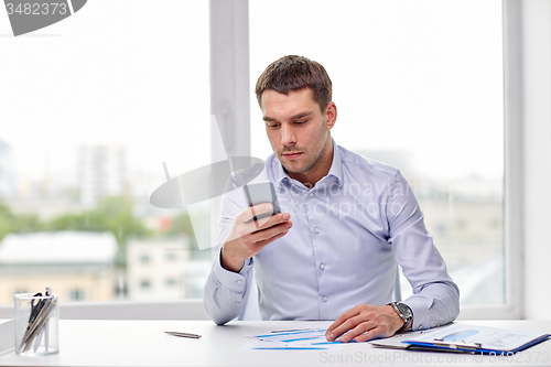 Image of close up of businessman with smartphone