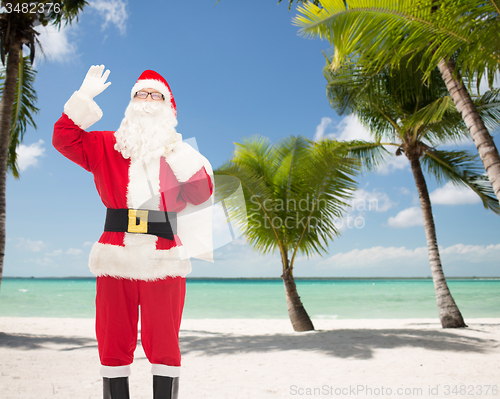 Image of man in costume of santa claus with bag