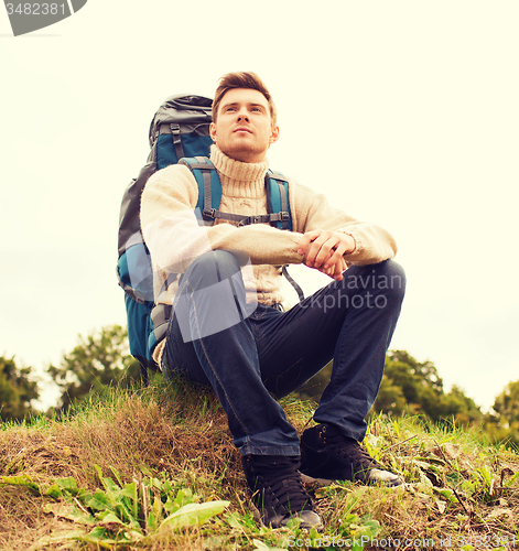 Image of man with backpack hiking