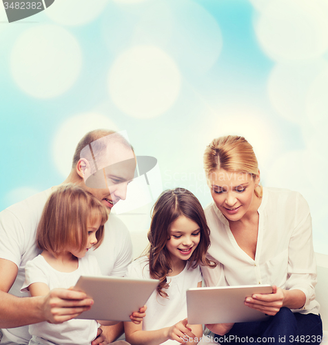 Image of happy family with tablet pc computers