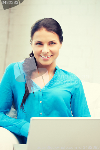 Image of happy woman with laptop computer