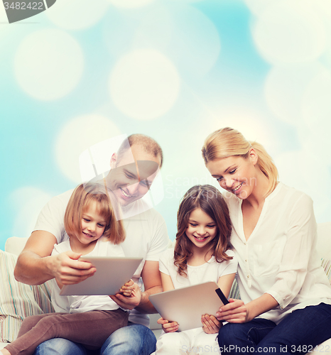 Image of happy family with tablet pc computers