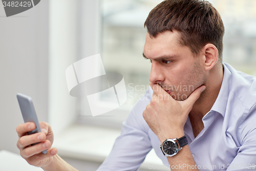 Image of close up of businessman with smartphone