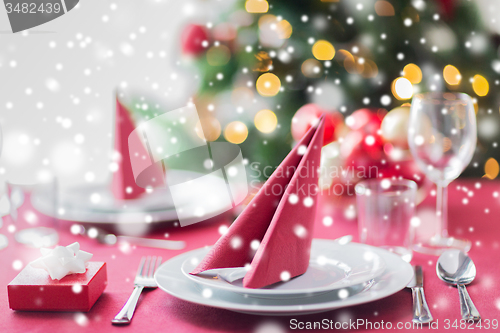 Image of room with christmas tree and decorated table