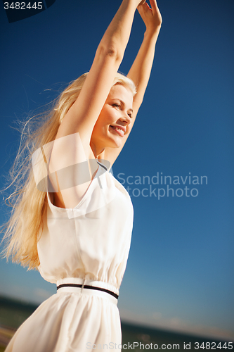 Image of beautiful woman enjoying summer outdoors