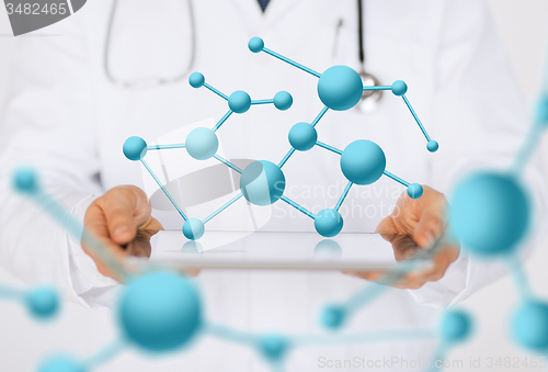 Image of male doctor holding tablet pc and stethoscope