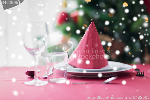 Image of room with christmas tree and decorated table