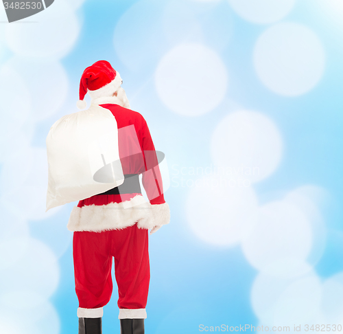 Image of man in costume of santa claus with bag