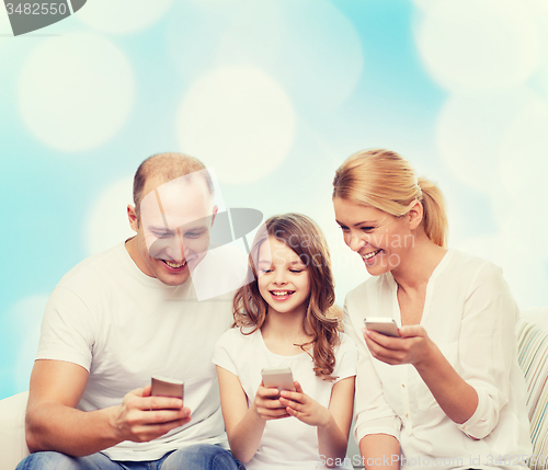 Image of happy family with smartphones