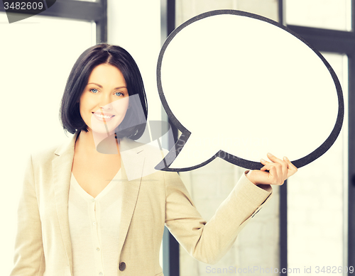 Image of smiling businesswoman with blank text bubble