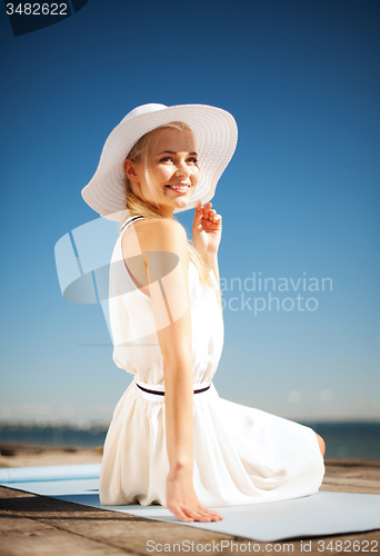 Image of beautiful woman enjoying summer outdoors