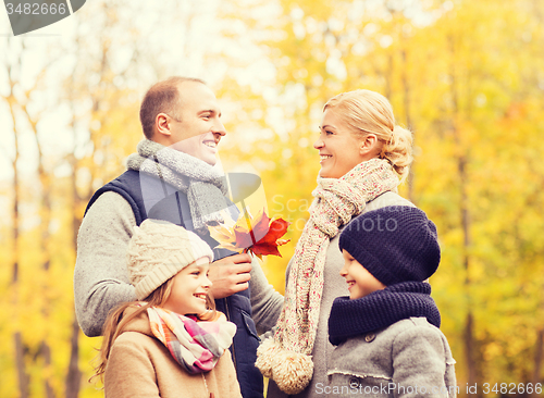 Image of happy family in autumn park