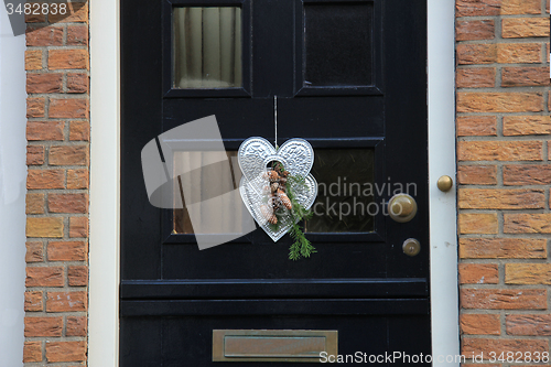 Image of Front door with Christmas decorations