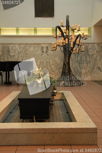 Image of Coffin with funeral flowers