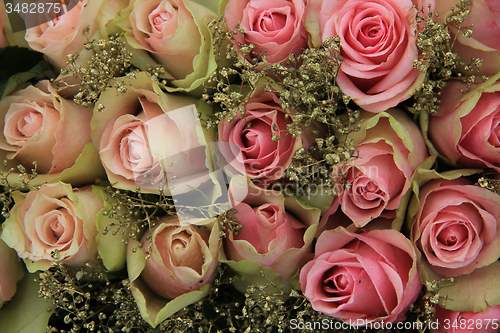 Image of Mixed pink roses in bridal arrangement