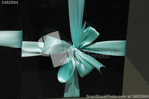 Image of Gift box with blue ribbon