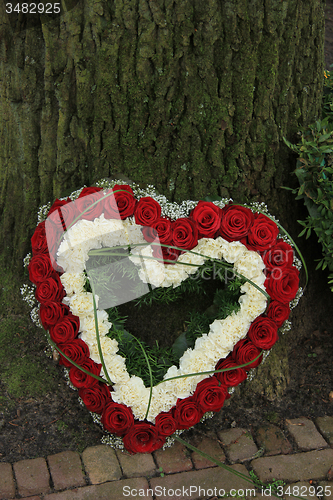 Image of Heart shaped sympathy flowers