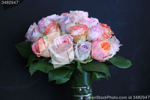 Image of Pastel roses in bridal bouquet