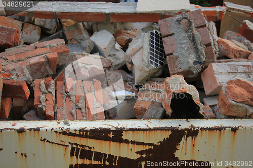 Image of Bricks in a dumpster