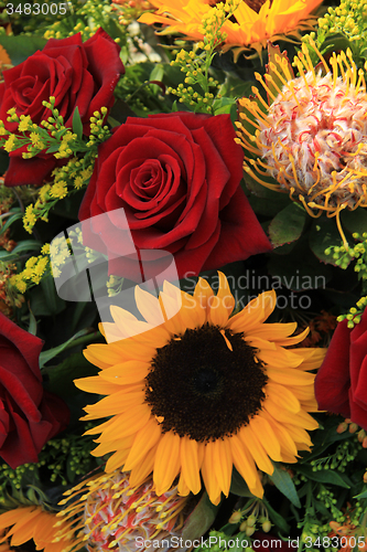 Image of Sunflowers and roses