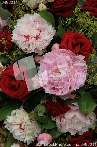 Image of Peonies and roses in a bridal bouquet