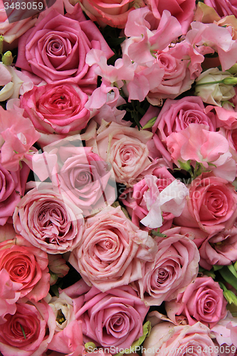 Image of Lathyrus and roses in a wedding bouquet