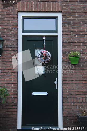 Image of Front door with Christmas decorations