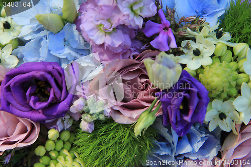 Image of Blue and purple wedding arrangement