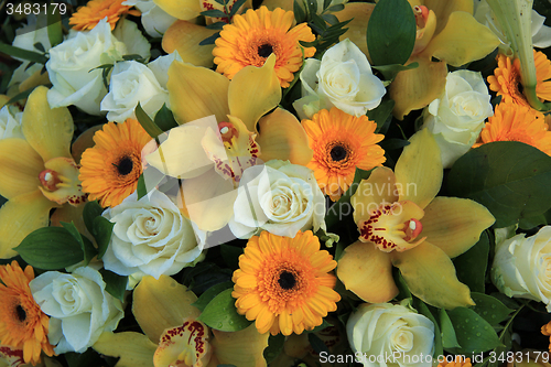 Image of Cymbidium orchids, Gerberas and roses