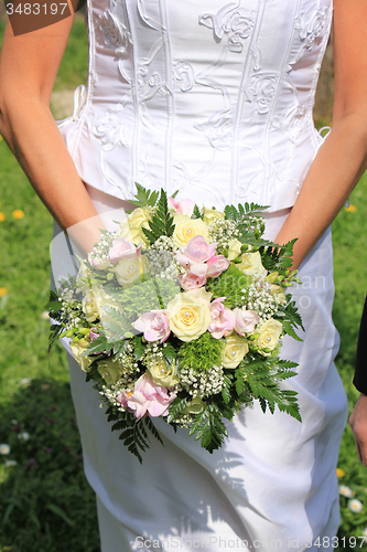 Image of Bride holding bouquet