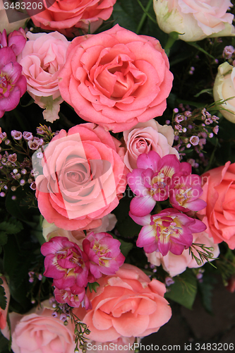 Image of Pink rose and freesia bridal flowers