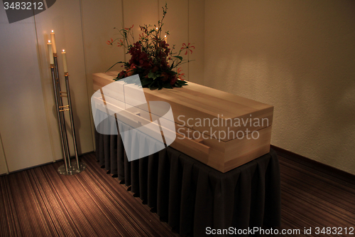 Image of Wooden casket in funeral home