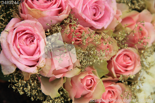 Image of Mixed pink roses in bridal arrangement