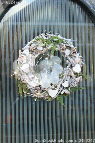 Image of christmas wreath with decorations on a door