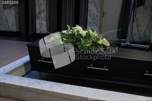 Image of Funeral flowers on a casket