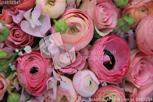 Image of Pink roses and ranunculus bridal bouquet