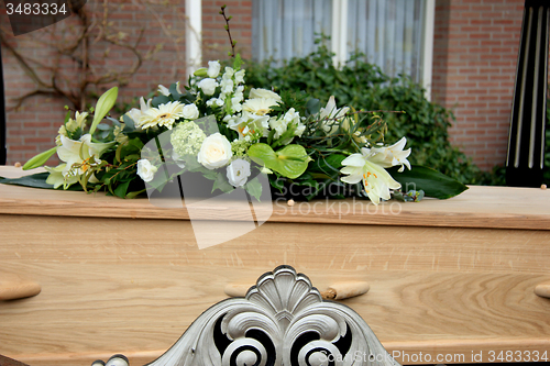 Image of Funeral flowers on a casket