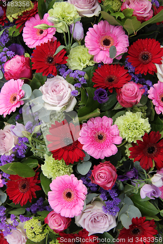 Image of Wedding arrangement in red, purple and pink