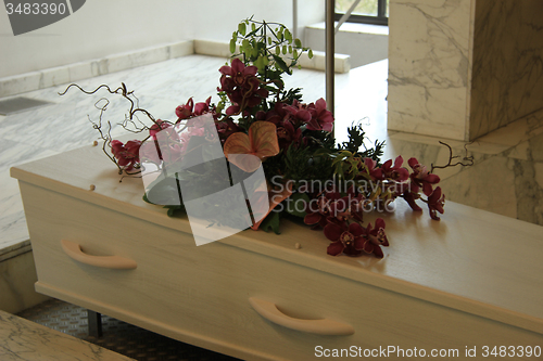 Image of Funeral flowers on a casket