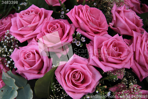 Image of Big pink roses in a bridal bouquet