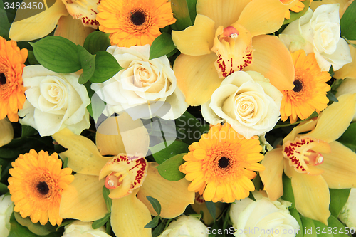 Image of Cymbidium orchids, Gerberas and roses